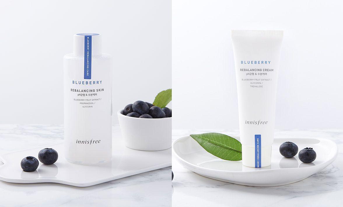 innisfree Blueberry Rebalancing Skin & Cream displayed with fresh blueberries, promoting natural ingredients in skincare.